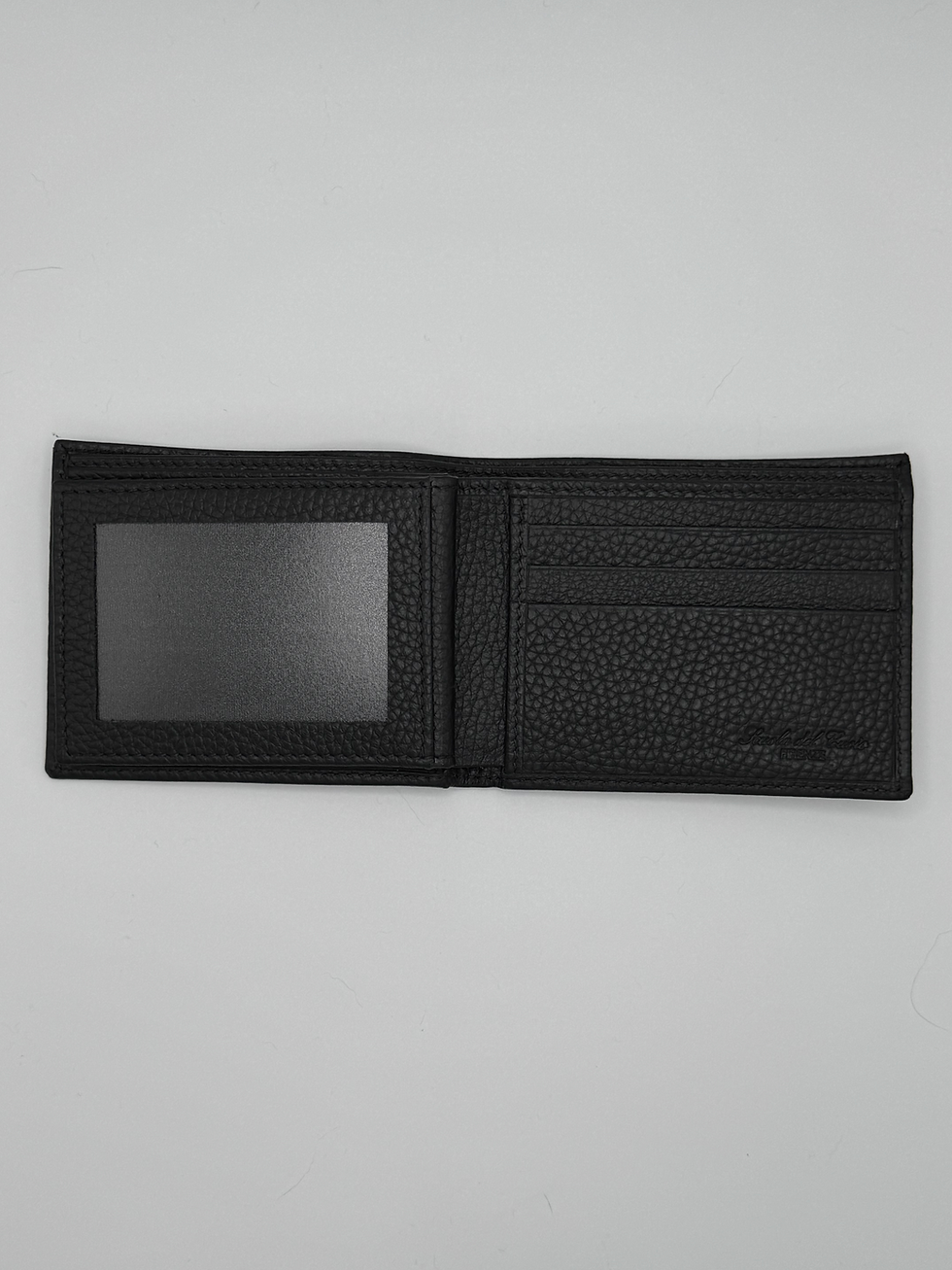 Open black leather wallet with ID slot and card compartments