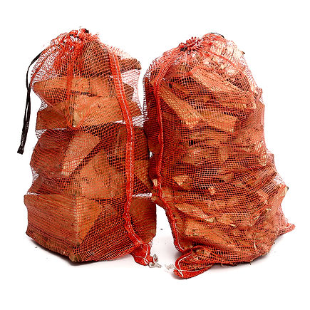 Orange string sacks of domestic logs ad kindling