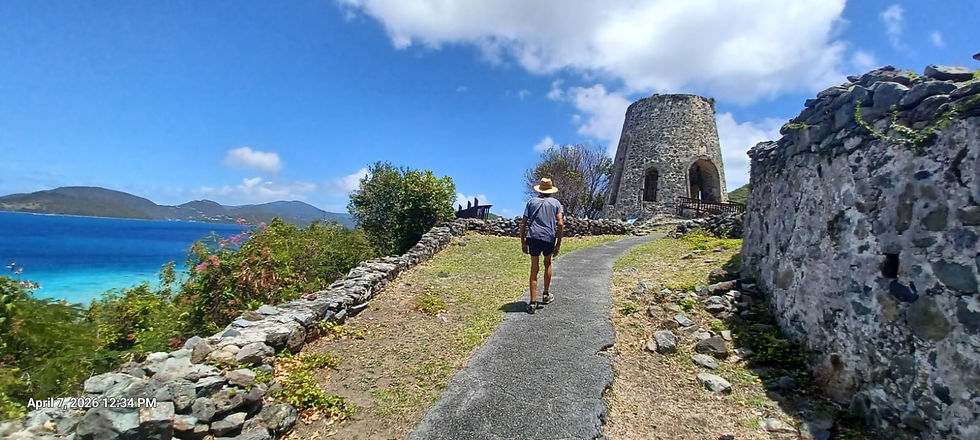 Hiking the trail to Annaburg Sugar Plantation ruins. The windmill base is ahead. Wind power was used for grinding sugar cane stalks to get the sweet juice for making sugar and rum.