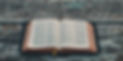 black book on gray wooden table_edited.jpg