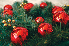 A Christmas wreath with red baubles