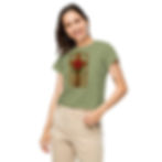 Woman wearing Cross with Rose Women’s high-waisted t-shirt smiling, tan pants, and background.