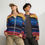 Thumbnail: Two models wearing colorful zip-up jackets and hats, posing; 3FoldLoveCo