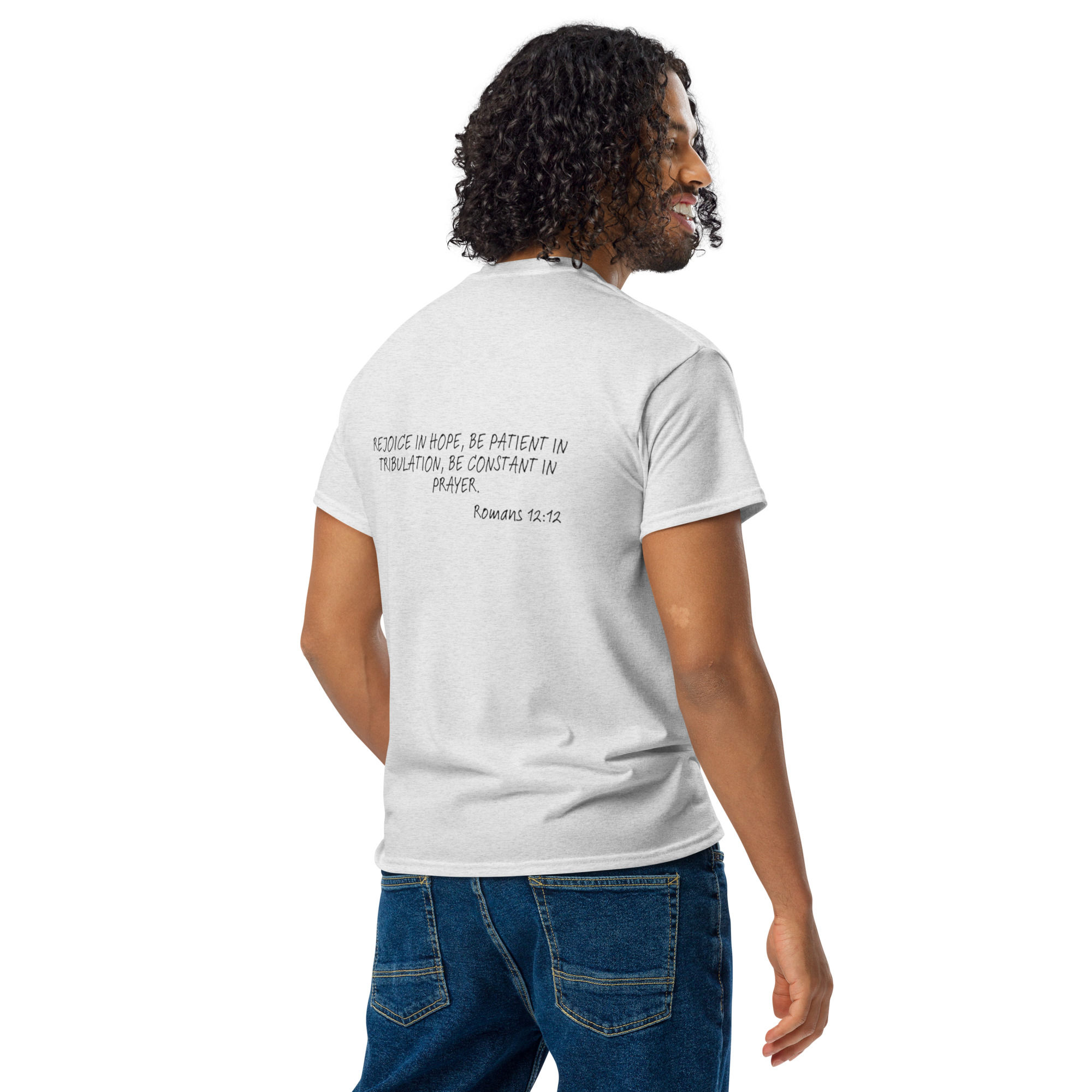 Man wearing a white t-shirt with text from the Bible, clothing fashion lifestyle.