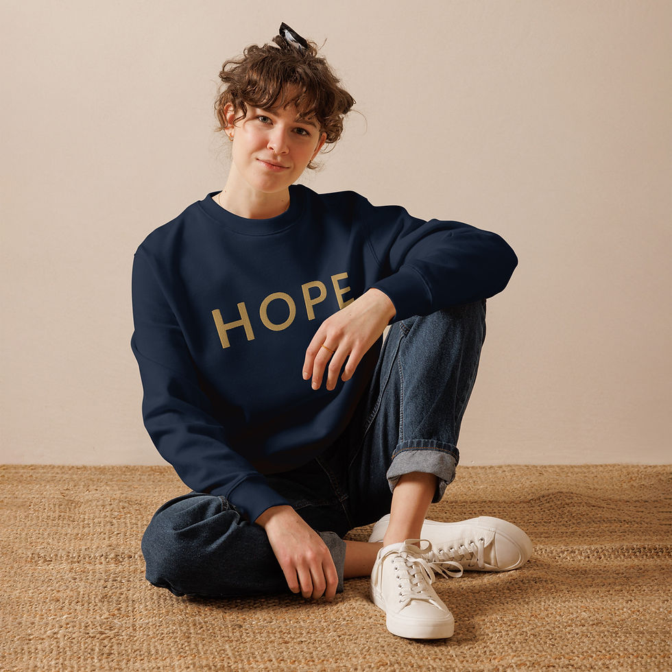 Thumbnail: Woman wearing blue HOPE sweatshirt with light background,