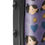 Thumbnail: Close-up of a purple tumbler with cartoon faces, stars, and hearts design.