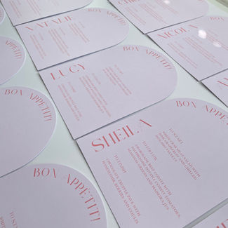Pink arched wedding menus