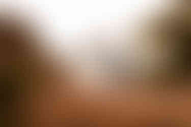 The groom twirls his bride in front of a beautiful Sedona backdrop