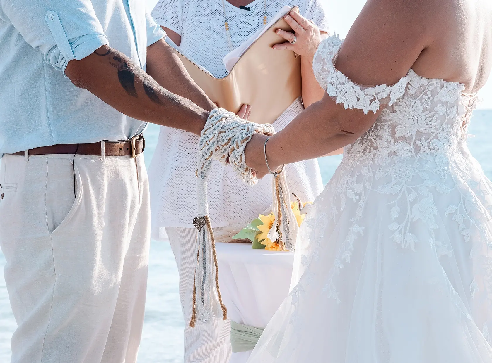 Bride and groom hand fasting ceremony at Florida beach wedding