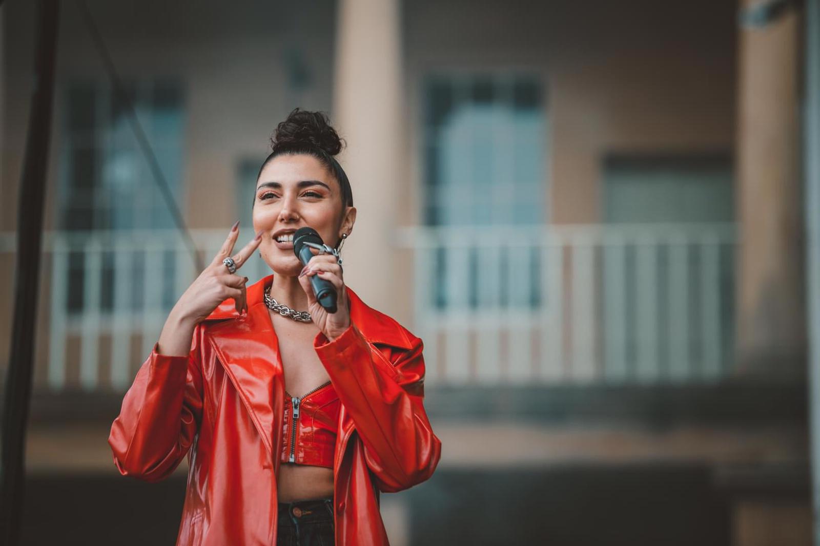 STORRY on stage with microphone