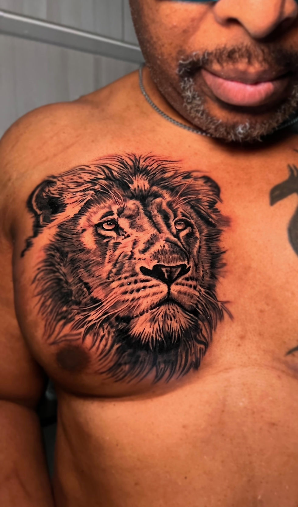 Graphic-style black and gray tattoo