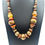 Thumbnail: Vintage Graduated Wood & Faux Amber Beaded Statement Necklace