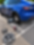 Blue car on a jack for roadside assistance tire change