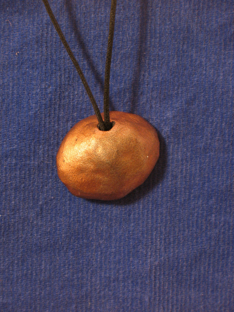 Back of the Om pendant.