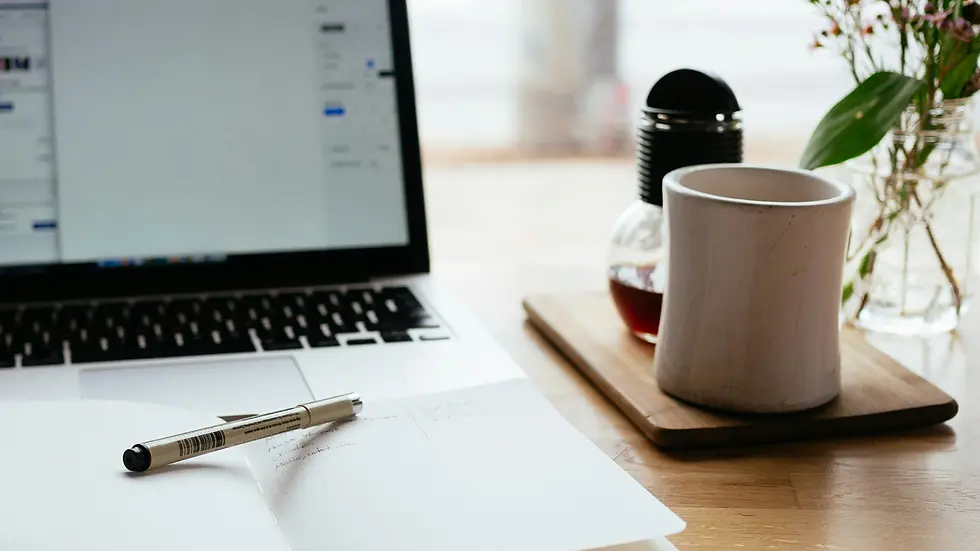 UGC Header with a coffee on a desk