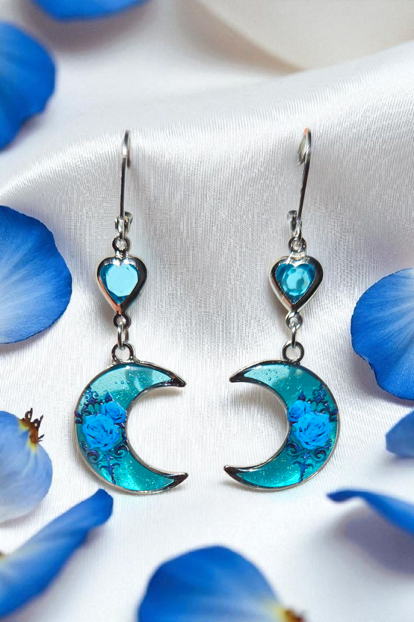 Moon shaped blue rose earrings