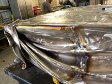 A close view of the joined sections before the seams are resolved into the finished surface.