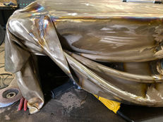The bronze corner and hanging folds during the surface-refinement stage.
