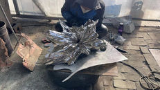 The polished steel base during the final workshop finishing stage.