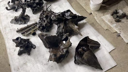 Separate cast metal sections before they are assembled into the Rock Table base.