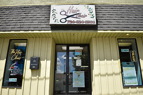 The Hair Chair store front and sign.