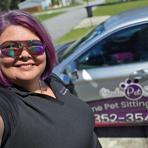 Owner Shannon Hendon with one Ocala Pet Sitting car wrapped.