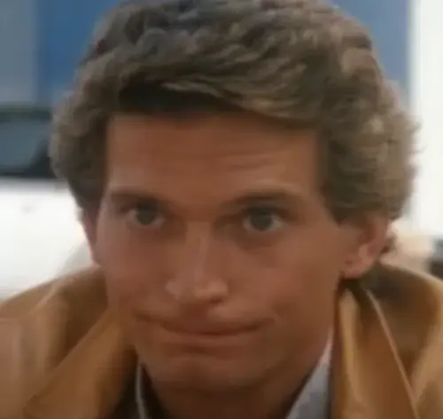 Joe Regalbuto as Norman Tuttle who plays Street Hawk