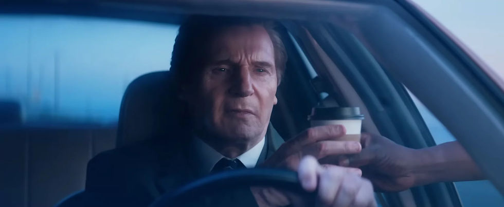 Liam Neeson as Frank Drebin Jr. getting coffee while driving full speed