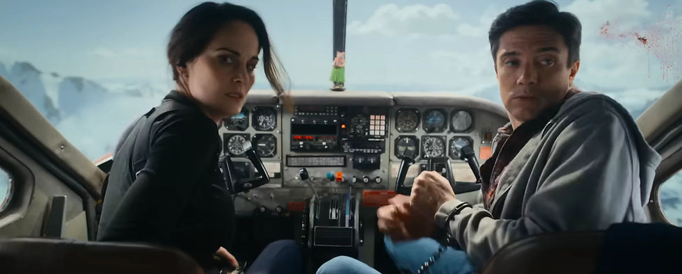 Michelle Dockery as US Marshal Madolyn Harris and Topher Grace as Winston in the Flight Risk (2025) movie