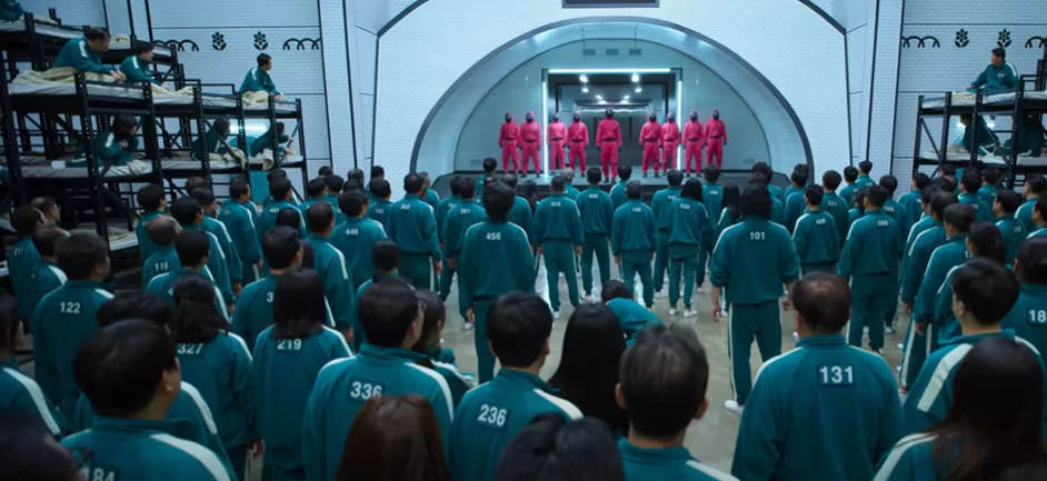The pink Soldiers addressing the players in Squid Game
