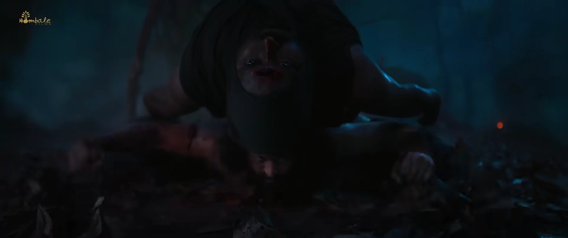 Rishab Shetty using a dead enemy as a shield