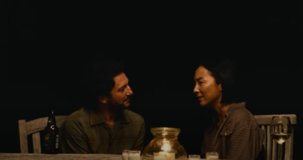 Greta Lee and John Magaro as Nora and Arthur looking at each other lovingly in Past Lives