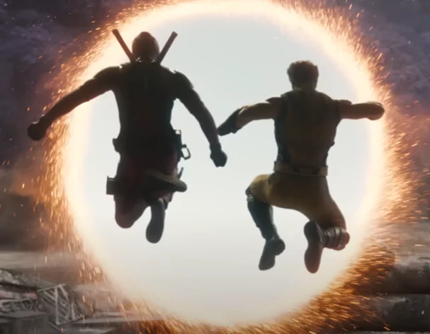Deadpool & Wolverine jumping into a mystical portal