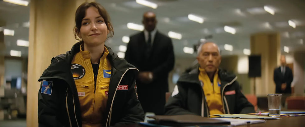 Milana Vayntrub plays Olesya Ilyukhina and Ken Leung plays Yáo Li-Jie