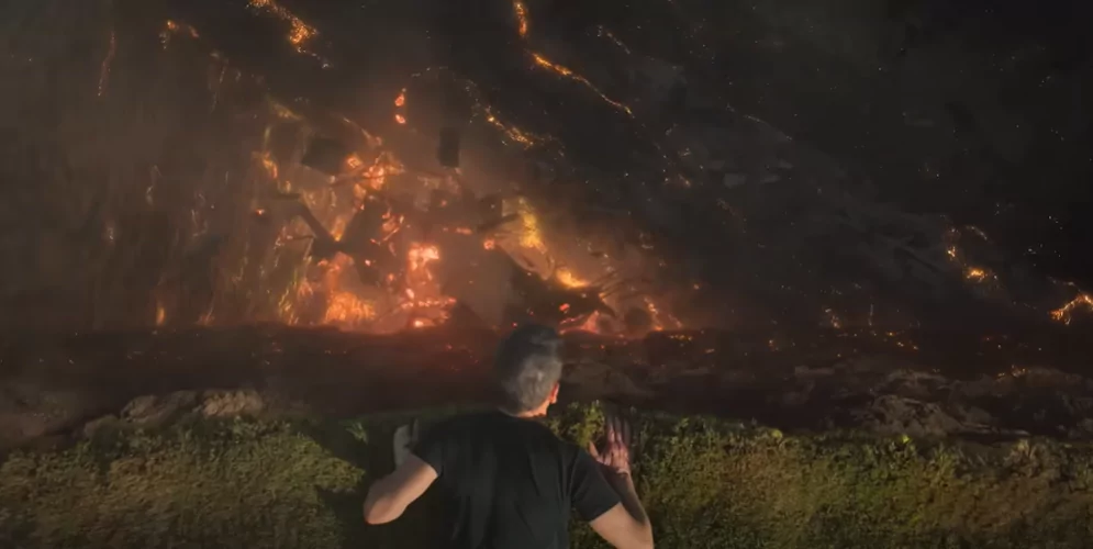 Hub looking at a house collapsing into Hell