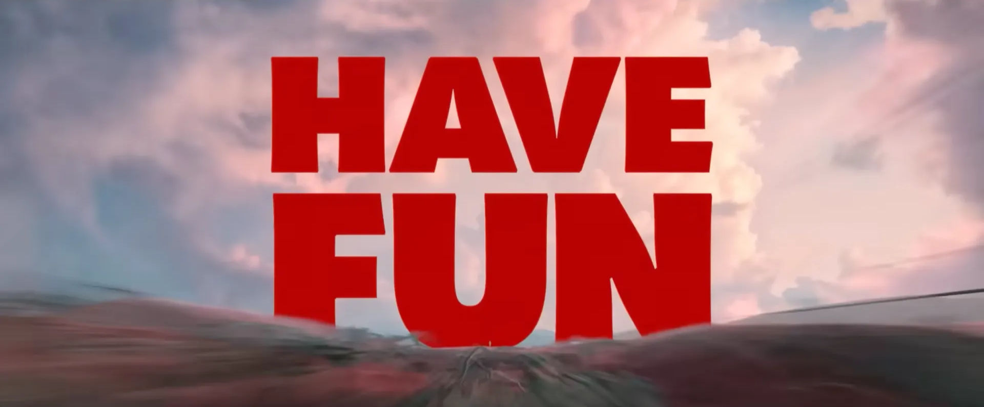 Red "HAVE FUN" text over a blurred, speeding landscape. From Gore Verbinski’s Good Luck, Have Fun, Don’t Die.