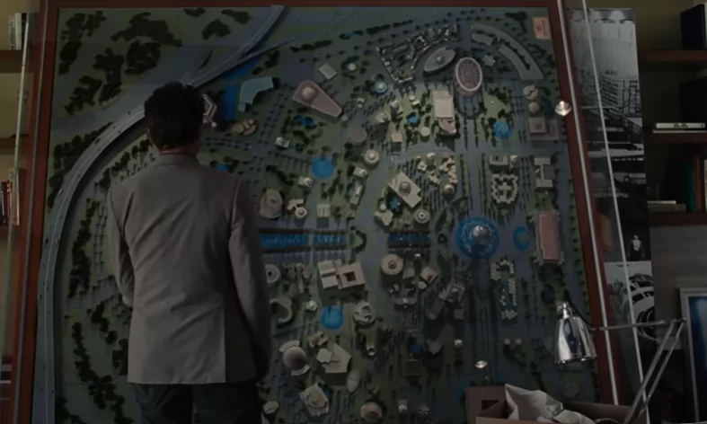 Robert Downey Junior as Tony Stark in Iron Man 2 looking at a model of the World's Fair