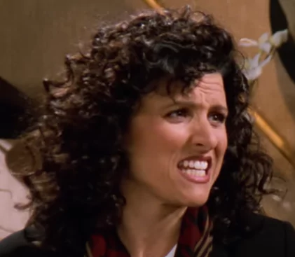 Julia Louis-Dreyfus as Elaine Benes in Seinfeld