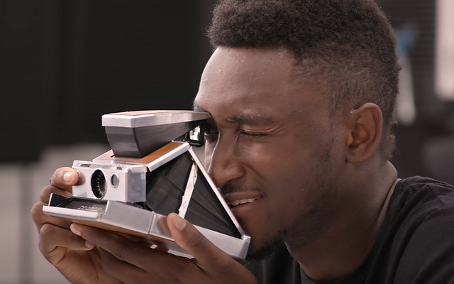 Marques Brownlee using an Instant Polaroid Camera