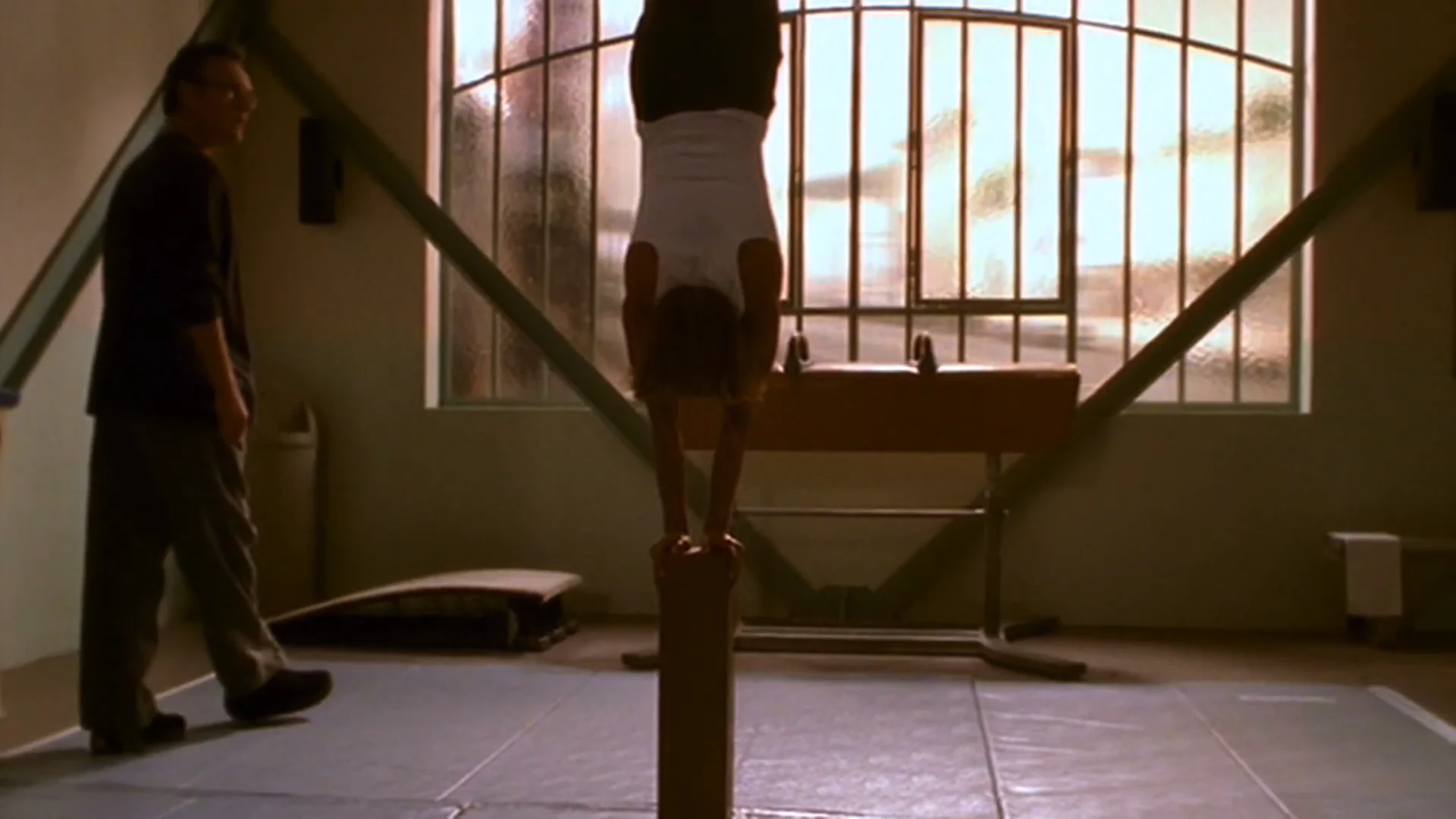 Giles helping Buffy train