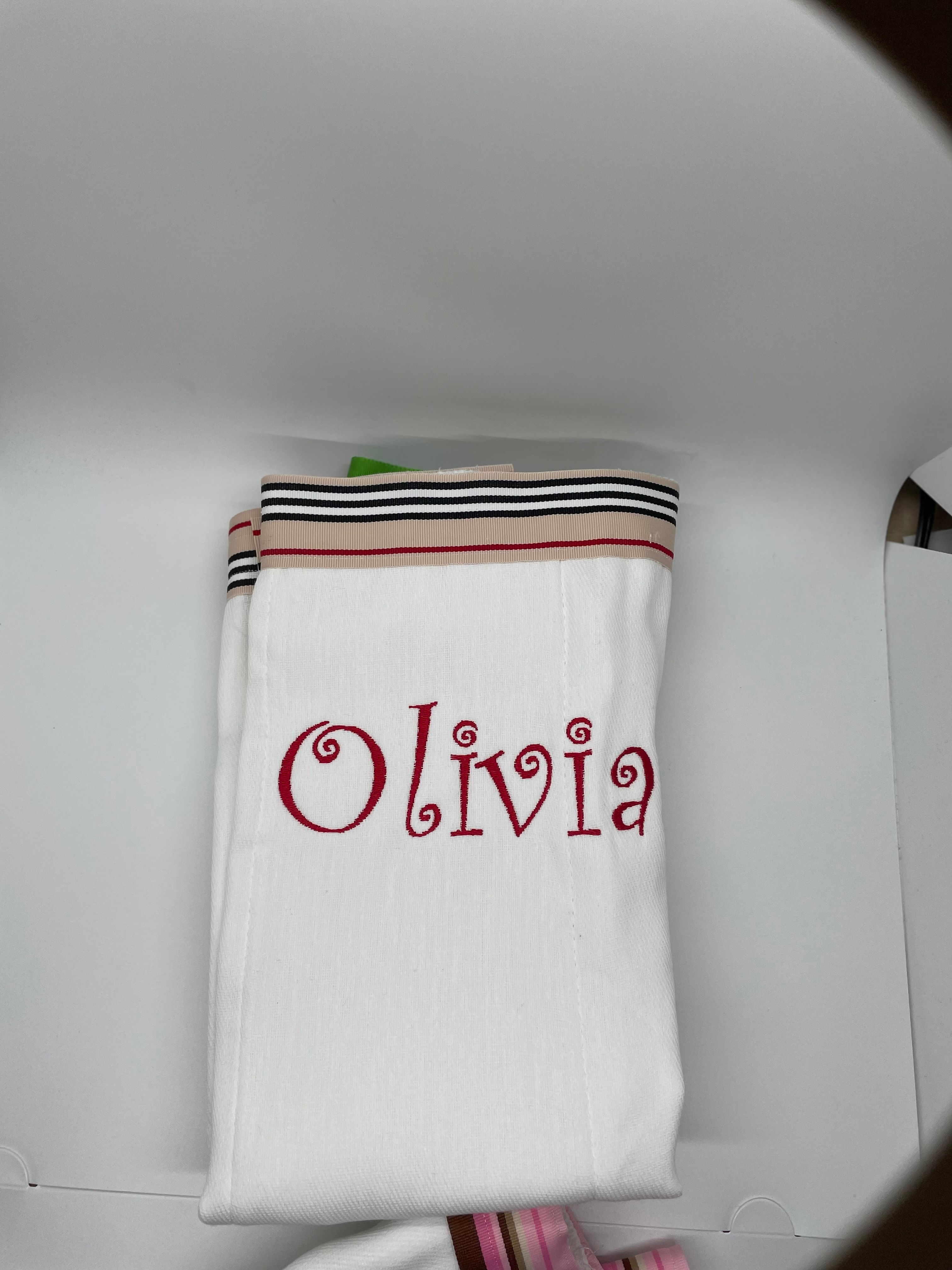 burp cloth with tan stripes, white stripes, red stripes and balck stripes ribbon trim. this can be personalized with a name, monogram or initial. 