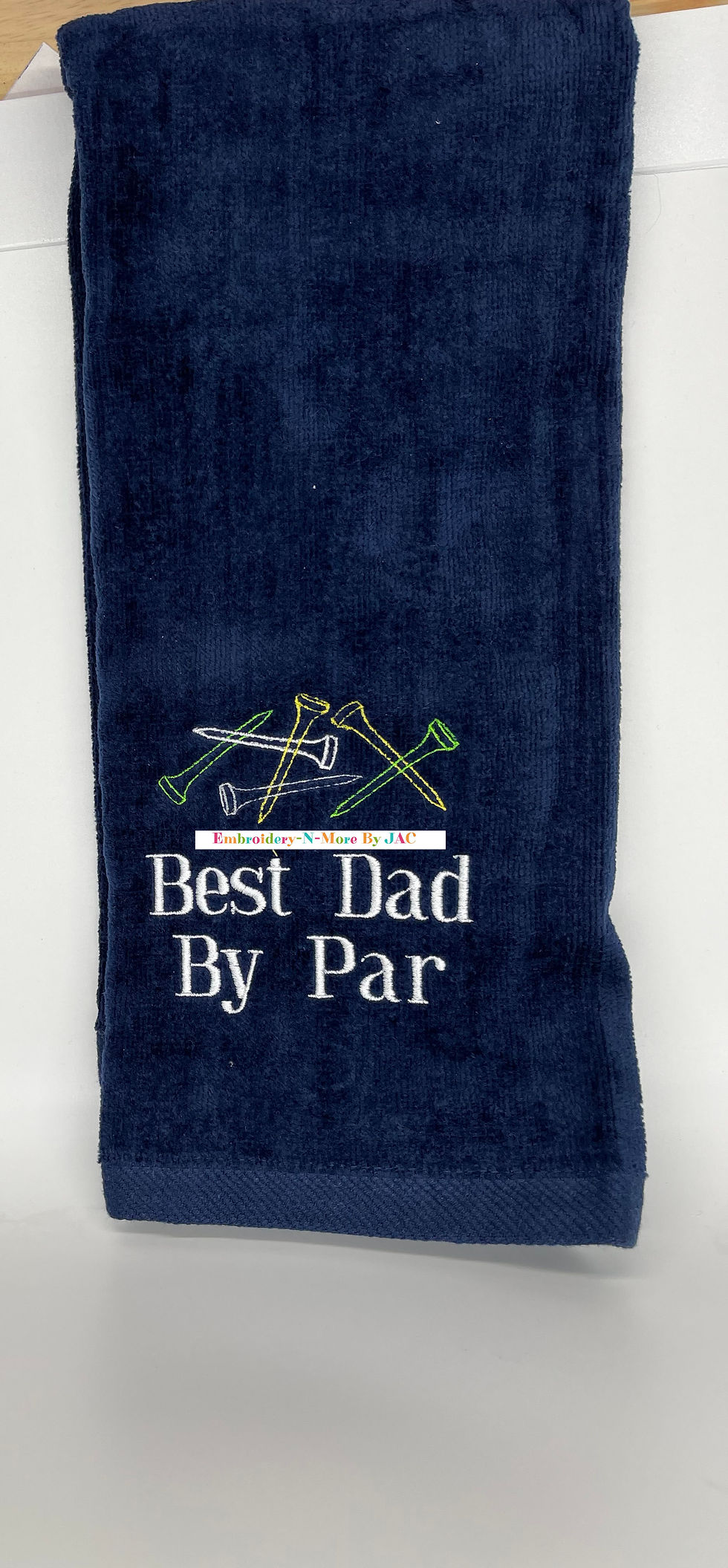 Navy Blue Tri-fold golf towel with multi color tees and best dad by par