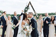 Bride and groom kissing after exchanging vows at Beau Cheval in Wartrace wedding venue