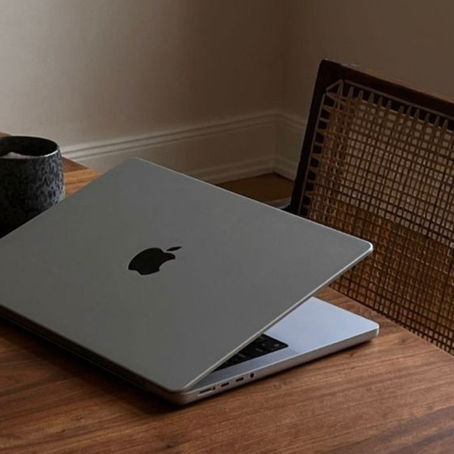 Laptop on the table with a coffee mug