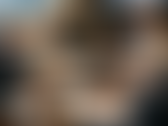 Executive leadership team at large boardroom table in focused planning discussion.