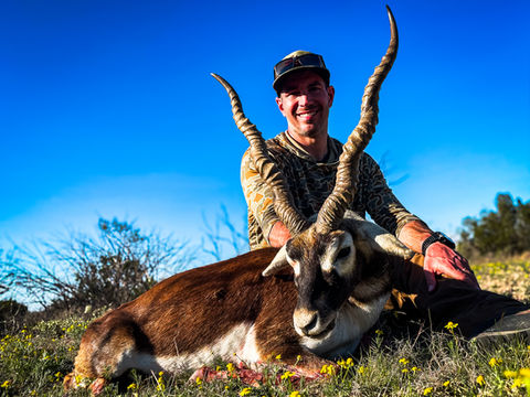 Hunter with trophy Blackbuck Antelope