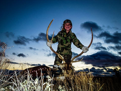 Hunter showcasing Axis Deer trophy from early hunting season