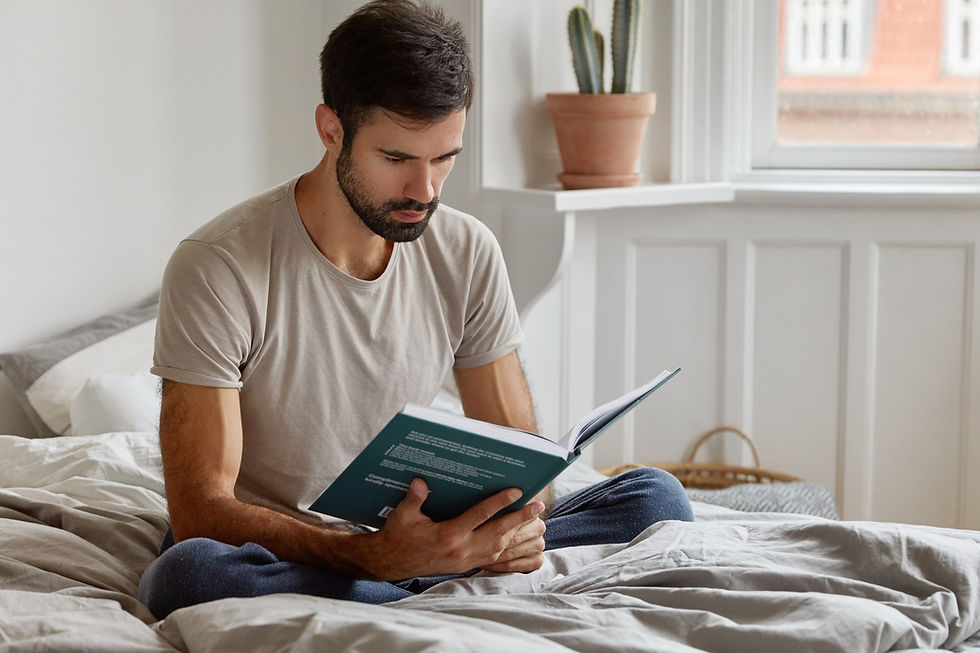 A fit, relaxed man reading a health journal