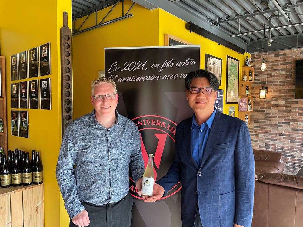 Photo showing Carol and Ambassador Kim with Geonbae Makgeolli