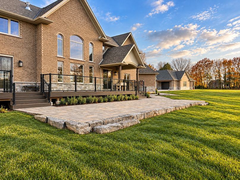 Elegant Brick Home with Landscaped Patio.png
